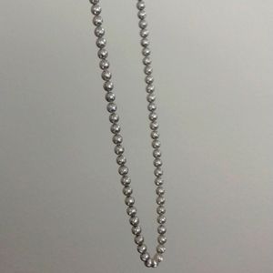 Long, heavy silver toned beaded necklace